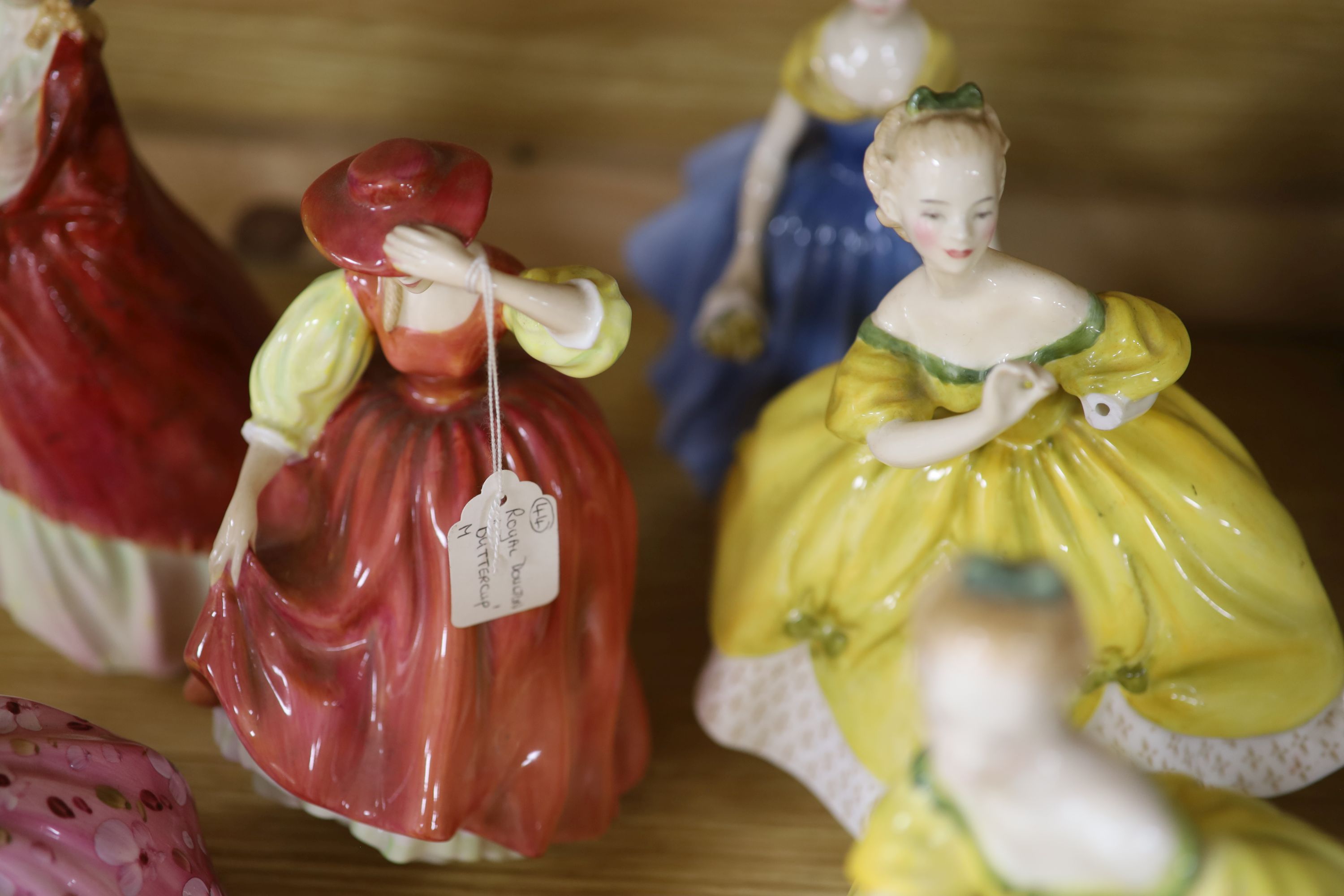 A collection of fourteen Royal Doulton figures